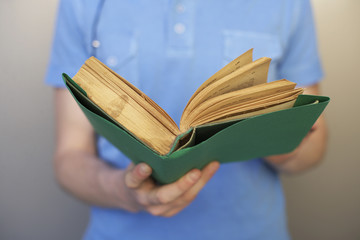 Young man holding a book