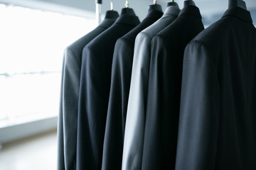 Suits hanging on a clothes rail in a company hall