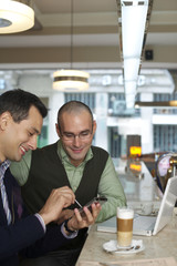 Two businessmen in a cafe