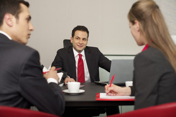 Three businesspeople having a meeting