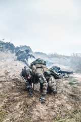 Squad of elite french paratroopers of 1st Marine Infantry Parachute Regiment RPIMA in action in...