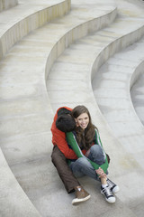 Young couple sitting on steps
