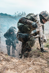 Two french paratroopers of 1st Marine Infantry Parachute Regiment RPIMA, in action jumping out of...