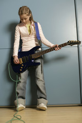 Girl holding an electric guitar