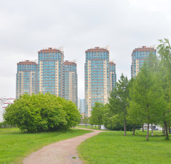 Park and modern residential building.