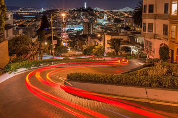 Crookedest Street at Night - A night panoramic overview of Lombard Street, the steepest and crookedest street, and city neighborhoods in Russian Hill and Telegraph Hill areas, San Francisco, USA.
