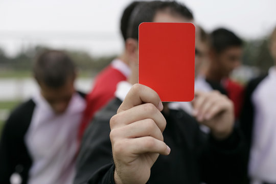 Referee showing the red card