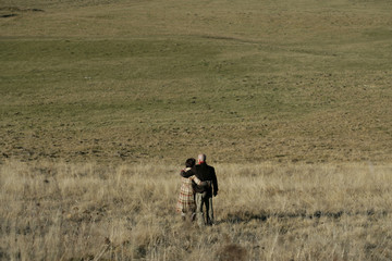 Man and woman standing on a field