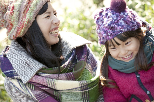 Mother and daughter smiling
