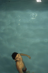 Darkhaired Man in a Swimming-Pool - Sports - Leisure Time