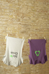 Two t-shirts hanging on clothesline