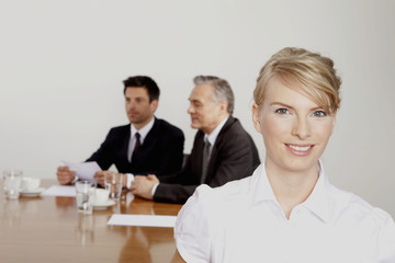 Three businesspeople in conference room, Bavaria, Germany