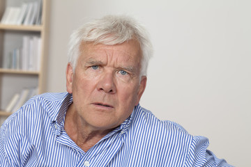 Senior man frowning