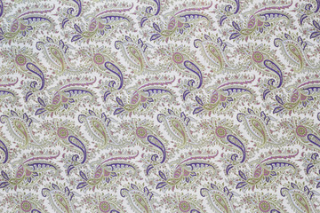 Cream cotton fabric in paisley pattern for background or texture