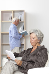 Fototapeta premium Senior couple reading at home