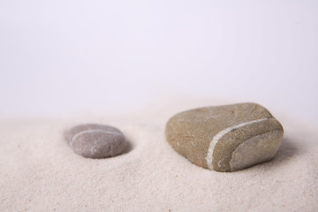Fototapeta na wymiar Two stones in sand
