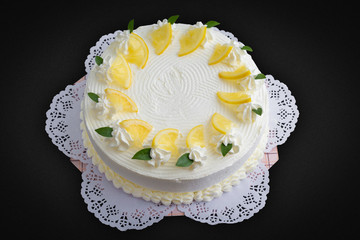 Lemon cake on black background