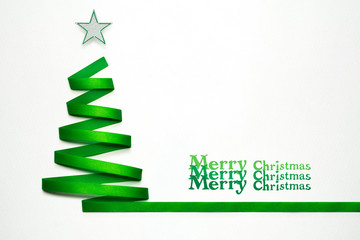 Magic tree / Creative concept photo of christmas tree made of ribbon on white background.