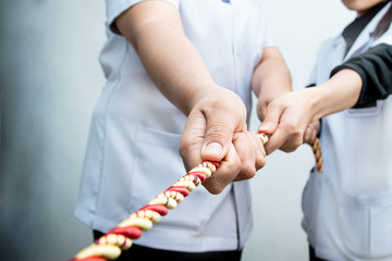 Sickness and healthy team fight in the tug of war