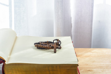 Catholic rosary beads and bible