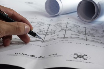 Engineering diagram blueprint paper drafting project sketch architectural,selective focus.