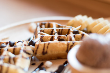 Belgian waffles with fruit and chocolate, forest fruit, all homemade, delicious batter