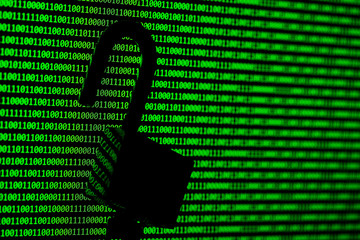 Hacker concept. computer binary codes and padlock .Green text on black background.