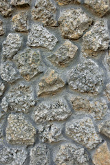 wall of stone between the stone visible cement