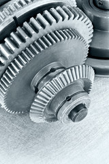 gear cogwheels on scratched surface. technology background.