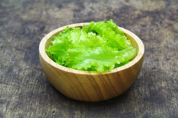 Salad leaf. Lettuce isolated on wooden background