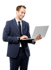 Businessman using laptop, isolated