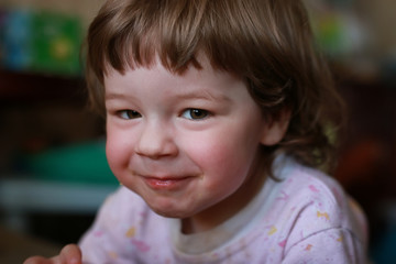 little boy eats greedily biting corn
