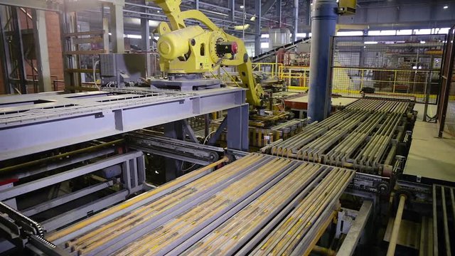 Automated machine assembling products on a modern production line. HD.