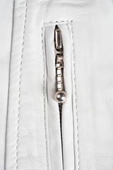 White leather jacket zipper. Macro leather jacket zipper and details