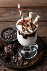 delicious milkshake with ice cream, chocolate and cookies