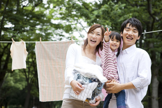 Portrait of family in front of clothesline