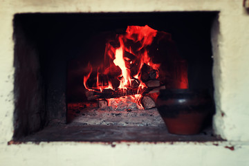 Obraz premium pot in the oven and oven fork