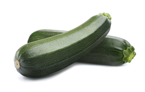 Green whole zucchini isolated on white background