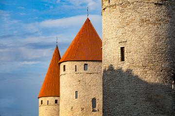 The medieval towers of old Tallinn, Estonia. Close up photo at sunset.