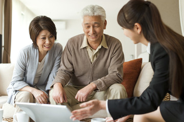 Senior couple talking to advisor