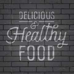 Obraz premium Hand drawn lettering slogan on brick wall background