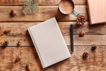 Notebook diary on wooden background