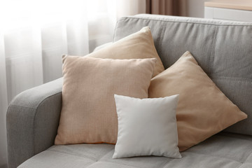 Blank soft pillow on sofa