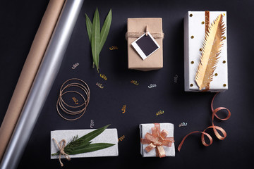 Crafted Christmas gifts and accessories on black background