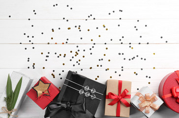 Obraz premium Christmas gift boxes on wooden background