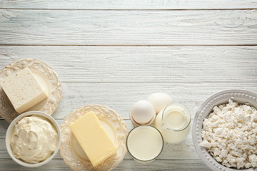 Different dairy products on wooden table