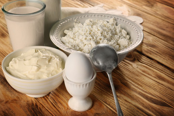 Different dairy products on wooden table