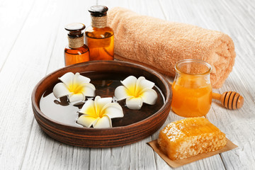 Beautiful honey spa composition on wooden table