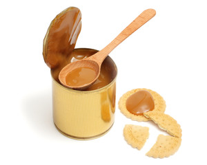 Condensed milk with wood spoon 