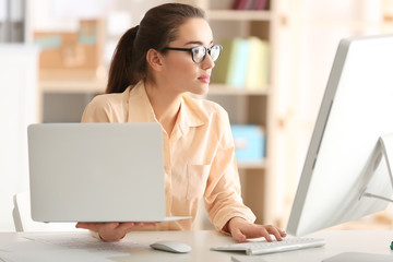 Young woman working at office